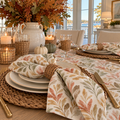 Sage and rust fall napkins featuring a botanical leaf pattern.