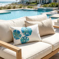 Light blue sand dollar indoor outdoor pillow for beach house decor.