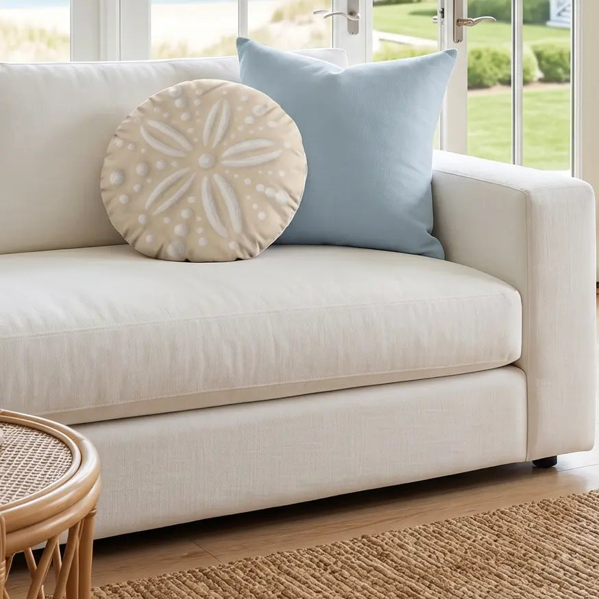 Sand dollar shaped coastal pillow with beach-inspired texture and seaside charm