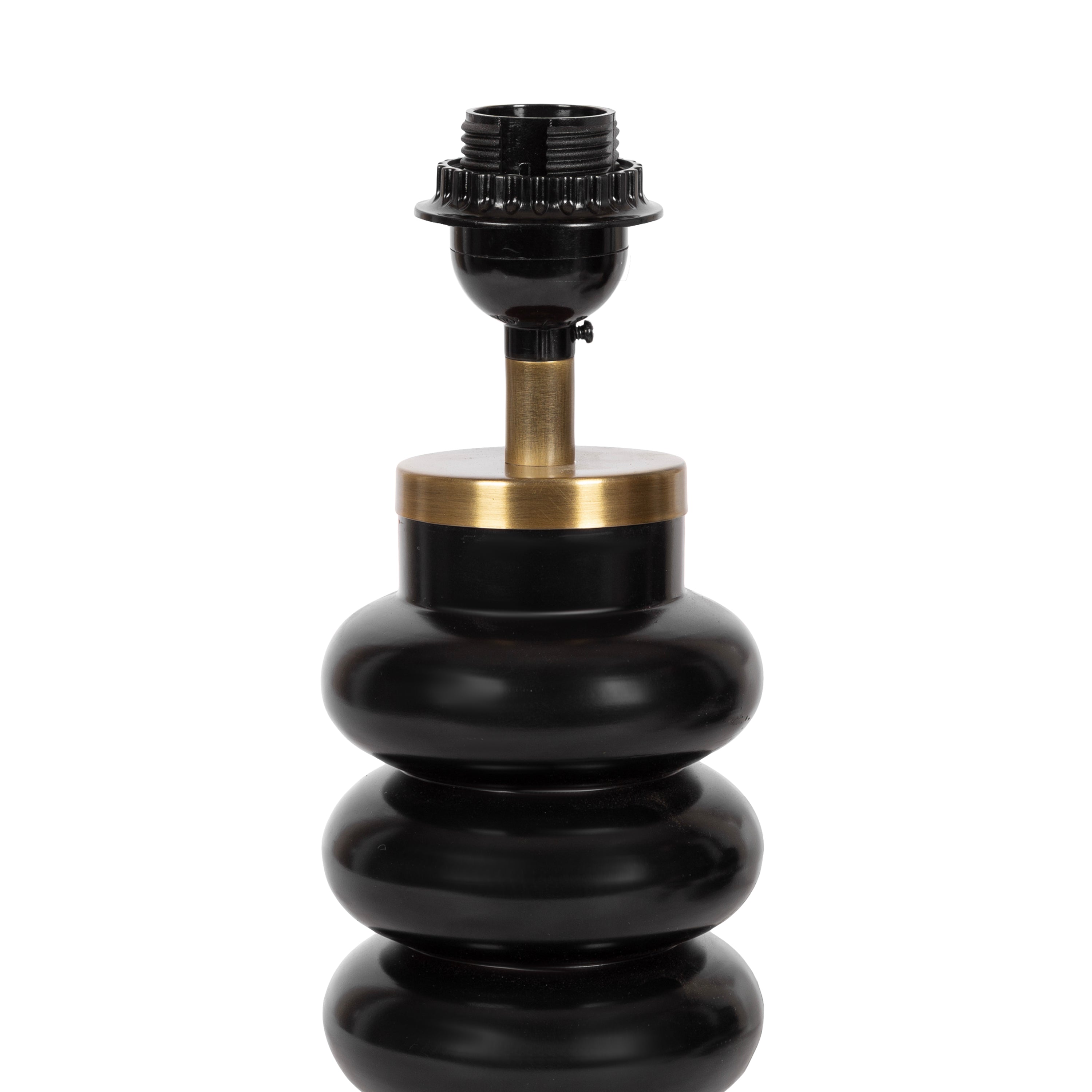 Black stacked orb lamp with brass base detail, adding contrast and architectural shape to a light interior.