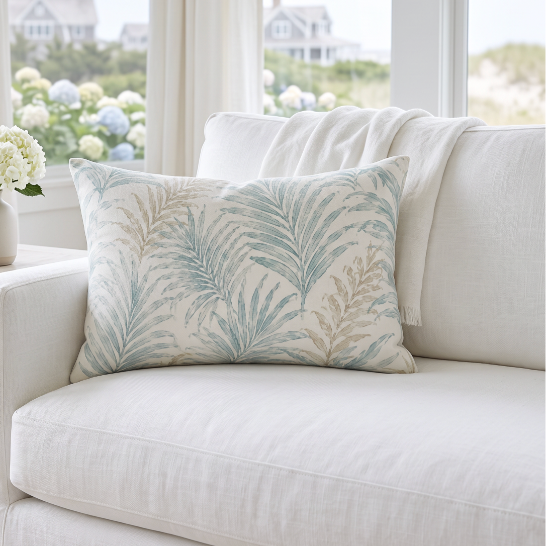 Seafoam and sand frond lumbar throw pillow with a creamy background for modern coastal living room decor.