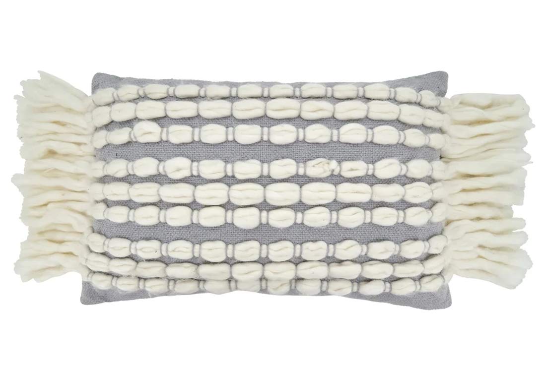 Neutral coastal throw pillow with raised cream loops on grey fabric for modern seaside decor.

