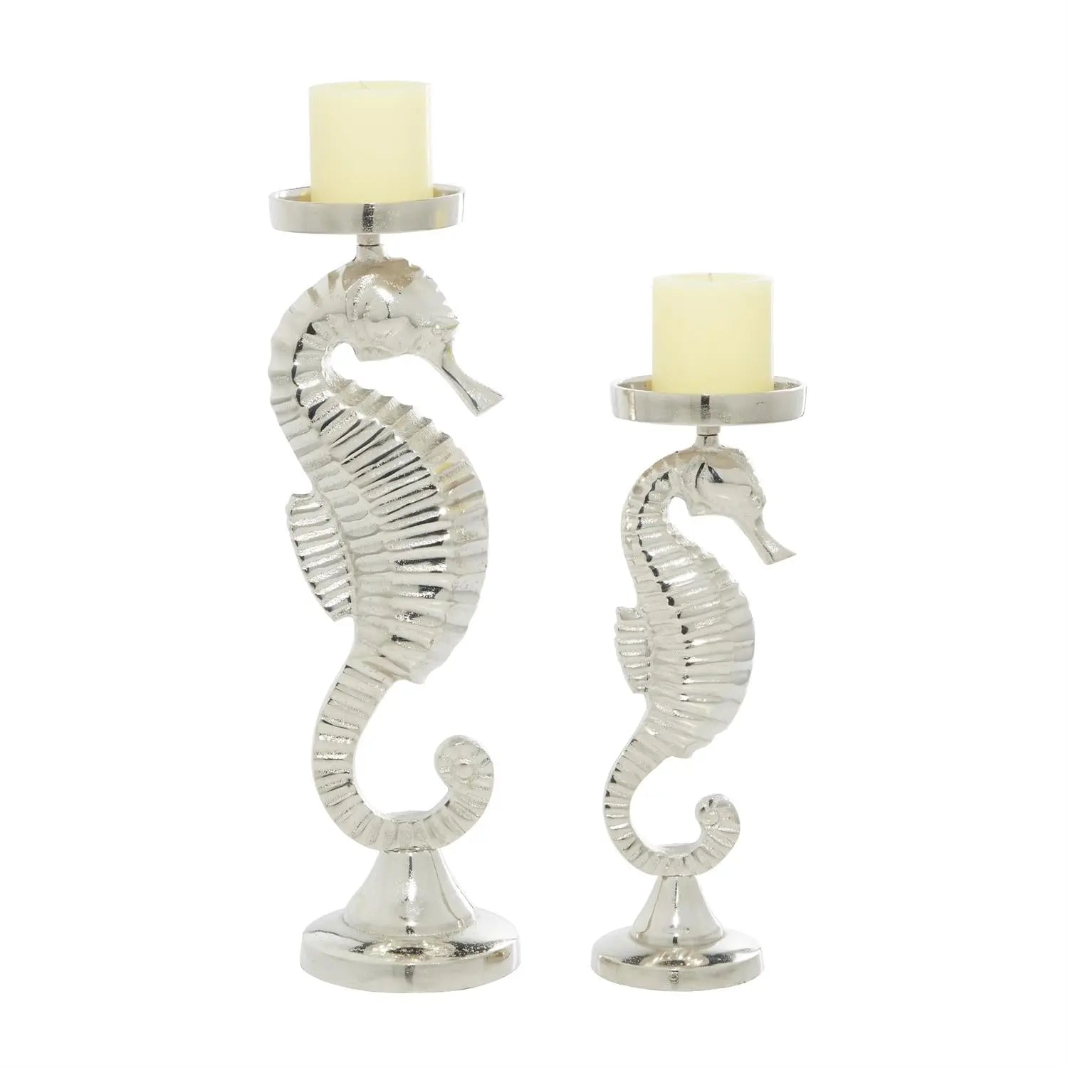 Two silver seahorse candle holders of varying heights on round bases, polished aluminum with cream candles.