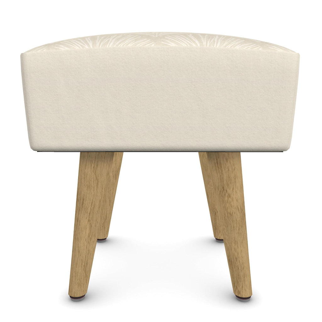 Square padded footstool with a coastal coral-branch pattern on the seat and four blond wood legs.