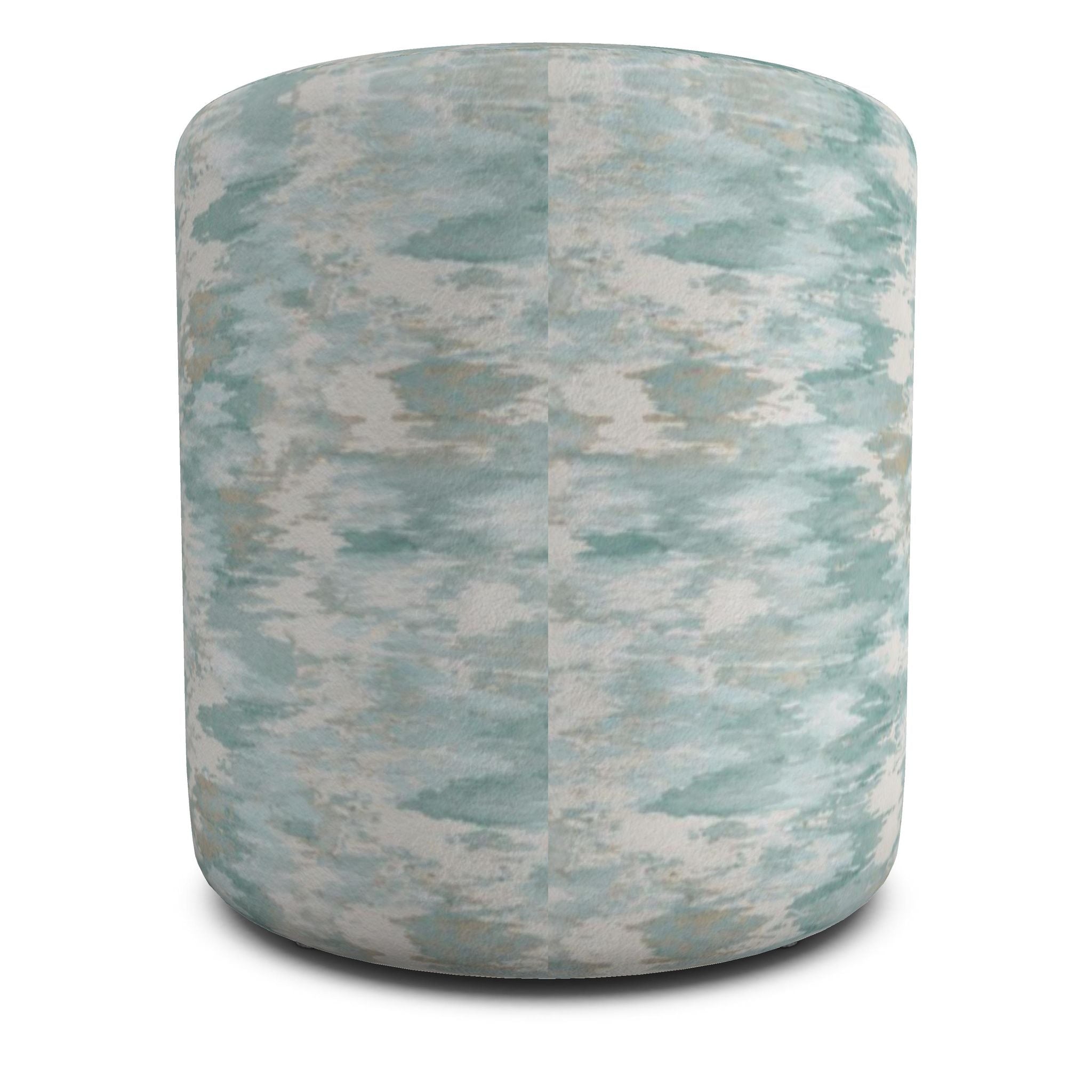 Soft aqua abstract print pouf adding subtle ocean-inspired color to a neutral beach house interior.