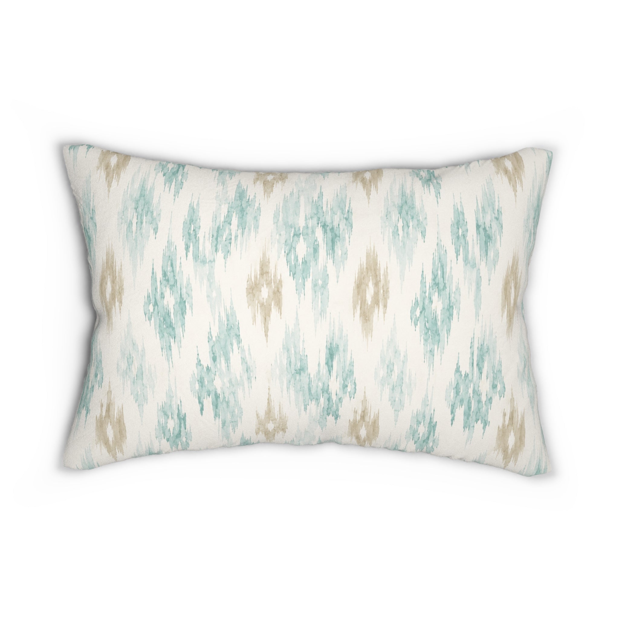 Modern coastal lumbar throw pillow with a neutral ikat pattern, perfect for layering on a white sofa