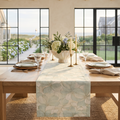 Soft blue hydrangea floral table runner on a neutral coastal dining table.