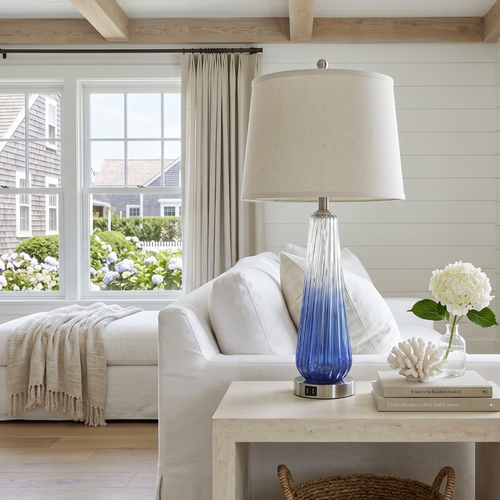 Blue ombre accent lamp with a sleek glass base and soft finish.
