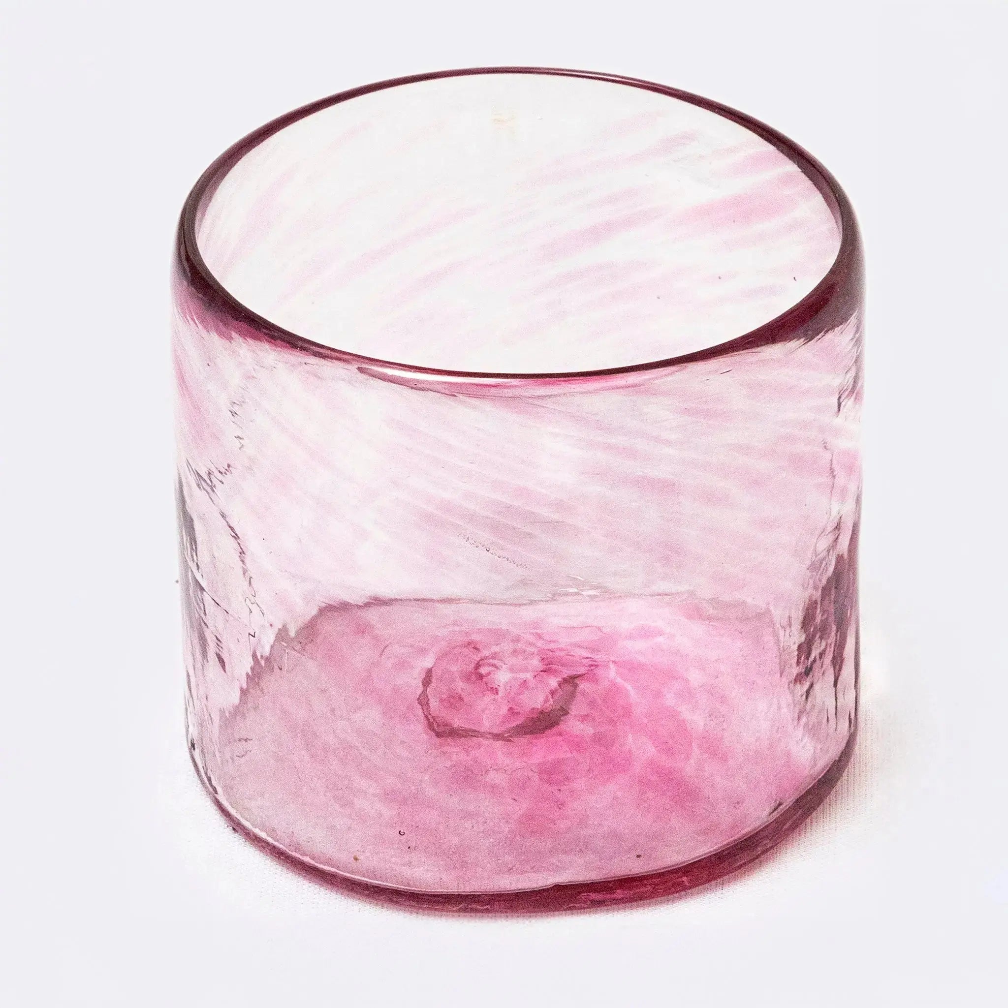 Soleado colorful glasses and tumblers arranged on a dining table.