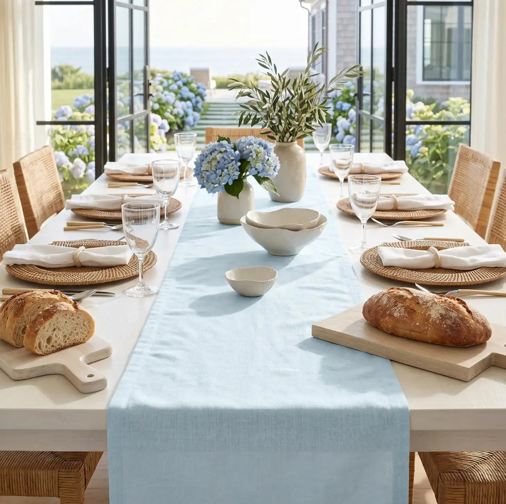 Solid light blue table runner styled for a clean, minimalist coastal tablescape.