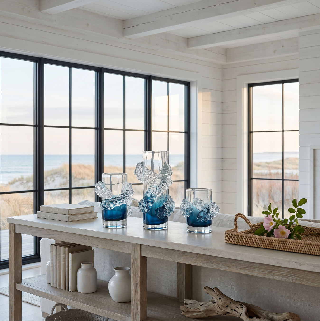 Handblown wavy blue and clear glass vase displayed on a console table for coastal home decor.