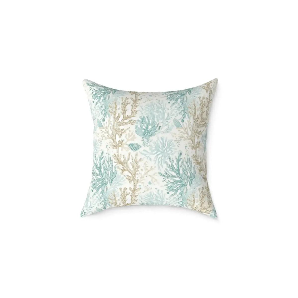 Tan and aqua coral pattern pillow in an elegant beach house interior.