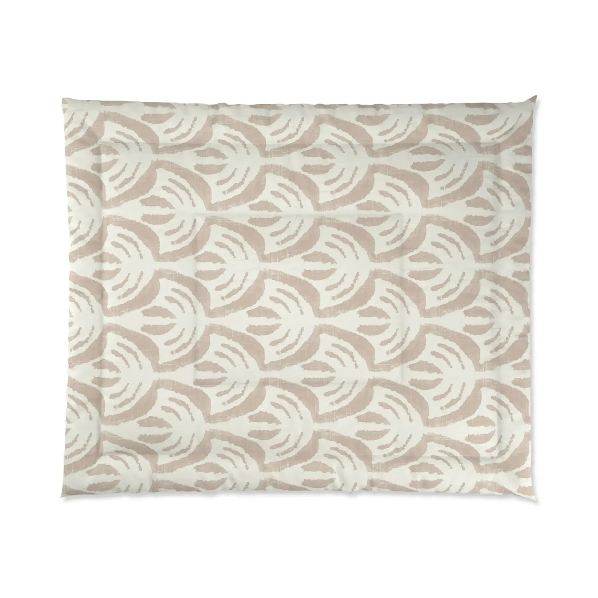 Tan pattern comforter set adding warm, neutral texture to a coastal bedroom