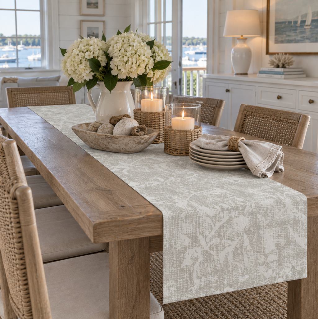 Taupe floral table runner for coastal decor with distressed botanical details and an ivory base