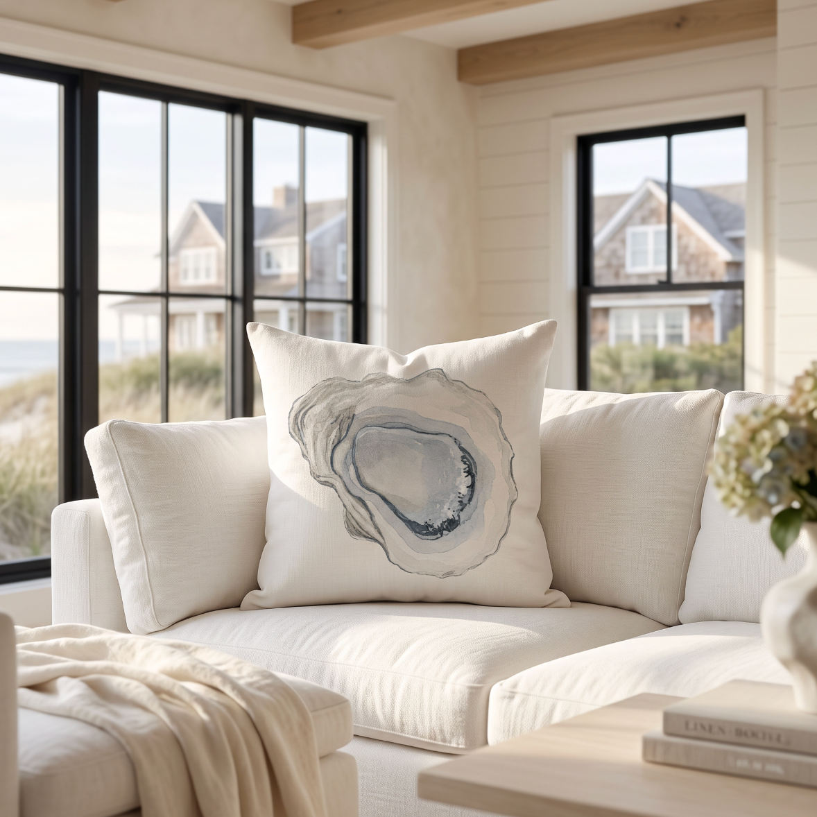 Taupe neutral oyster shell throw pillow that complements modern coastal interiors.