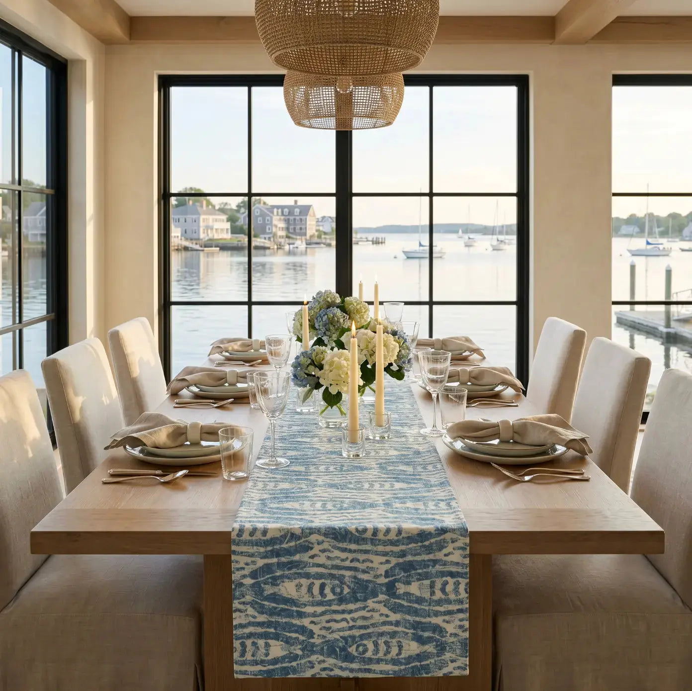 Teal ikat fish table runner styled with a seashell and driftwood centerpiec