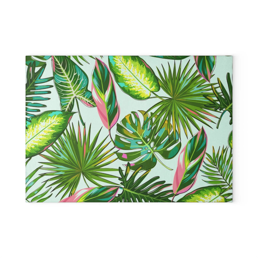 Isla Palm Glass Cutting Board with tropical palm leaf pattern in green and pink accents.