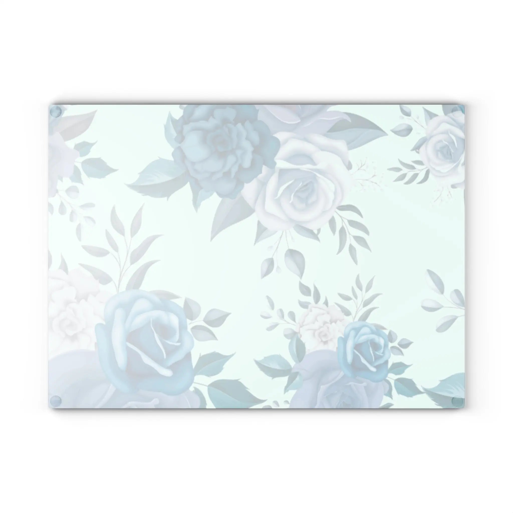 Blue floral glass cutting board with soft teal roses on a pale mint background.