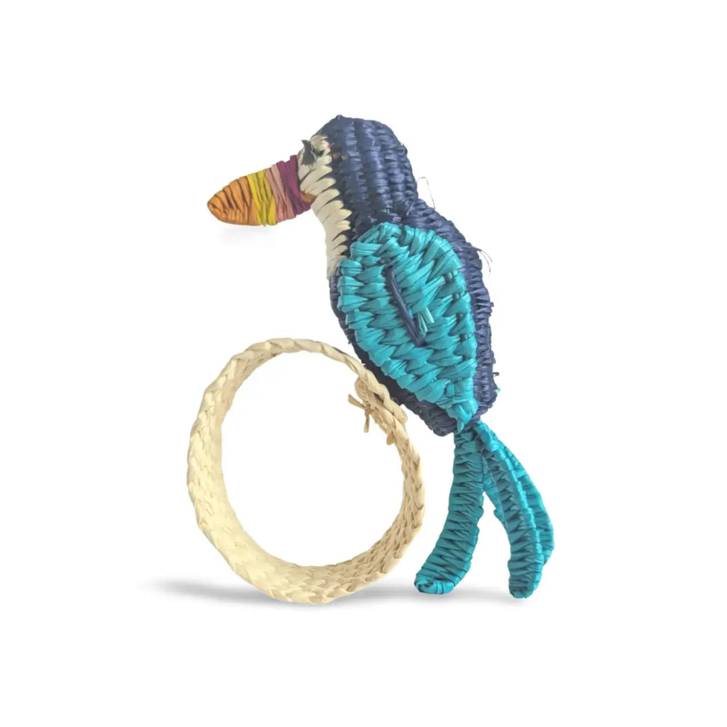 Closeup of toucan handwoven Iraca napkin ring showing detailed bird design.
