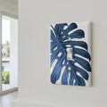 Modern coastal room with blue botanical switch plate accent
