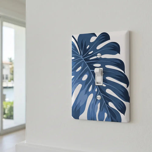 Modern coastal room with blue botanical switch plate accent