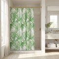 Coastal beach house bathroom with palm leaf patterned curtain