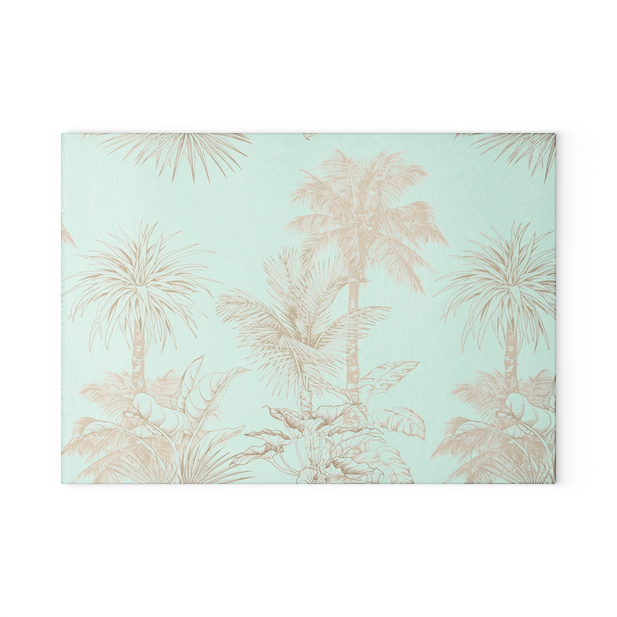 Aqua cutting board decorated with tan tropical palm trees and foliage for a coastal kitchen look.