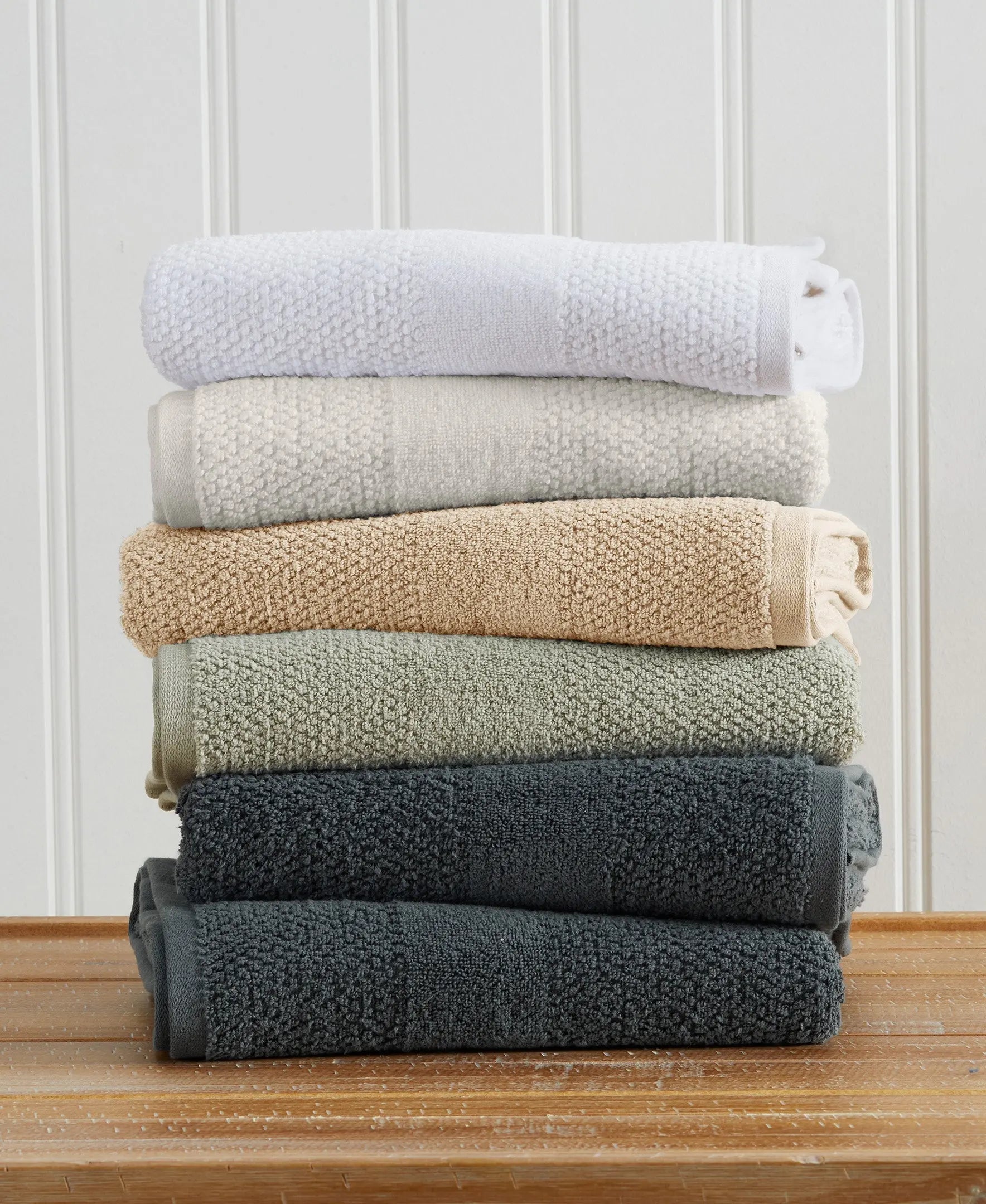 Great Bay Home Marbella Collection 100% cotton woven texture bath towel set, 6 towels stacked in white to charcoal neutrals.