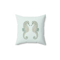 Twin Seahorse Throw Pillow featuring two illustrated seahorses facing each other on pale aqua background
