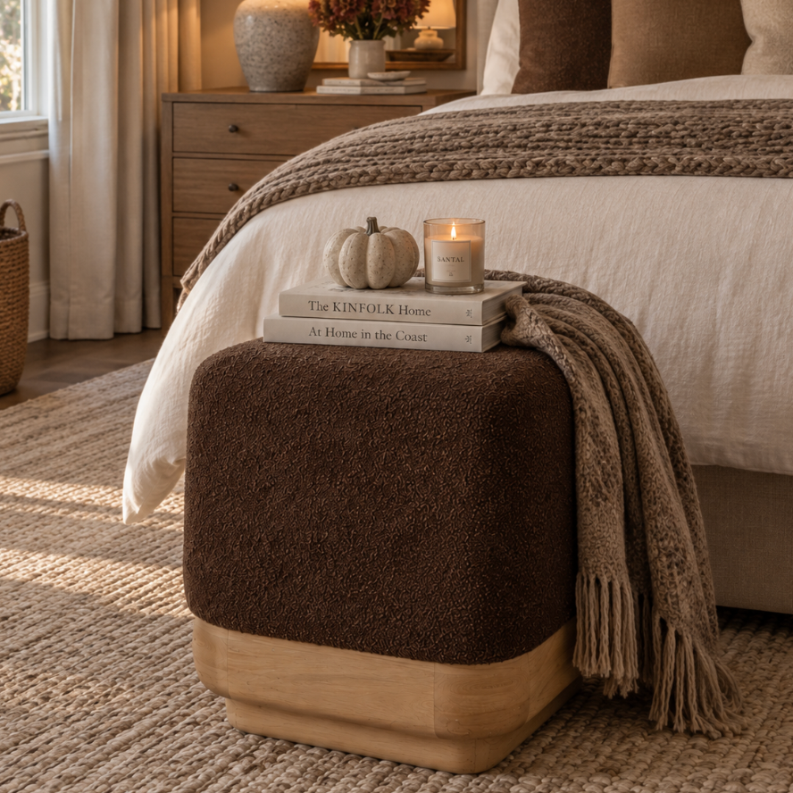 Textured brown boucle ottoman used as an accent footstool