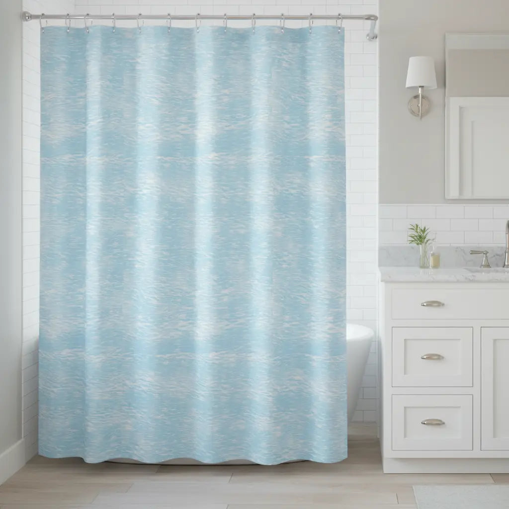 Coastal Tide Shower Curtain with light blue water texture for calming bathroom decor.