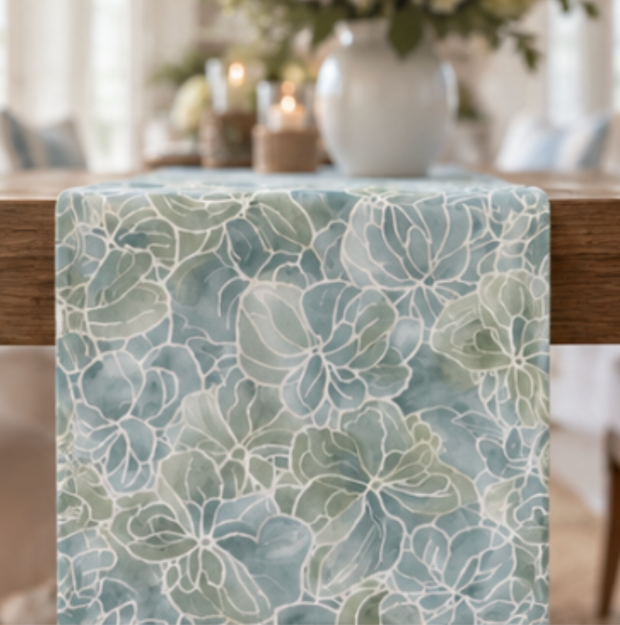 Watercolor-style hydrangea table runner in soft sea-glass blue and sage green tones