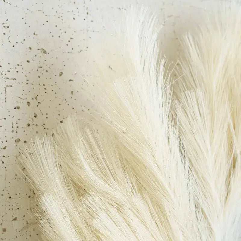 Boho style pampas grass wreath in white and yellow tones for year-round decor.