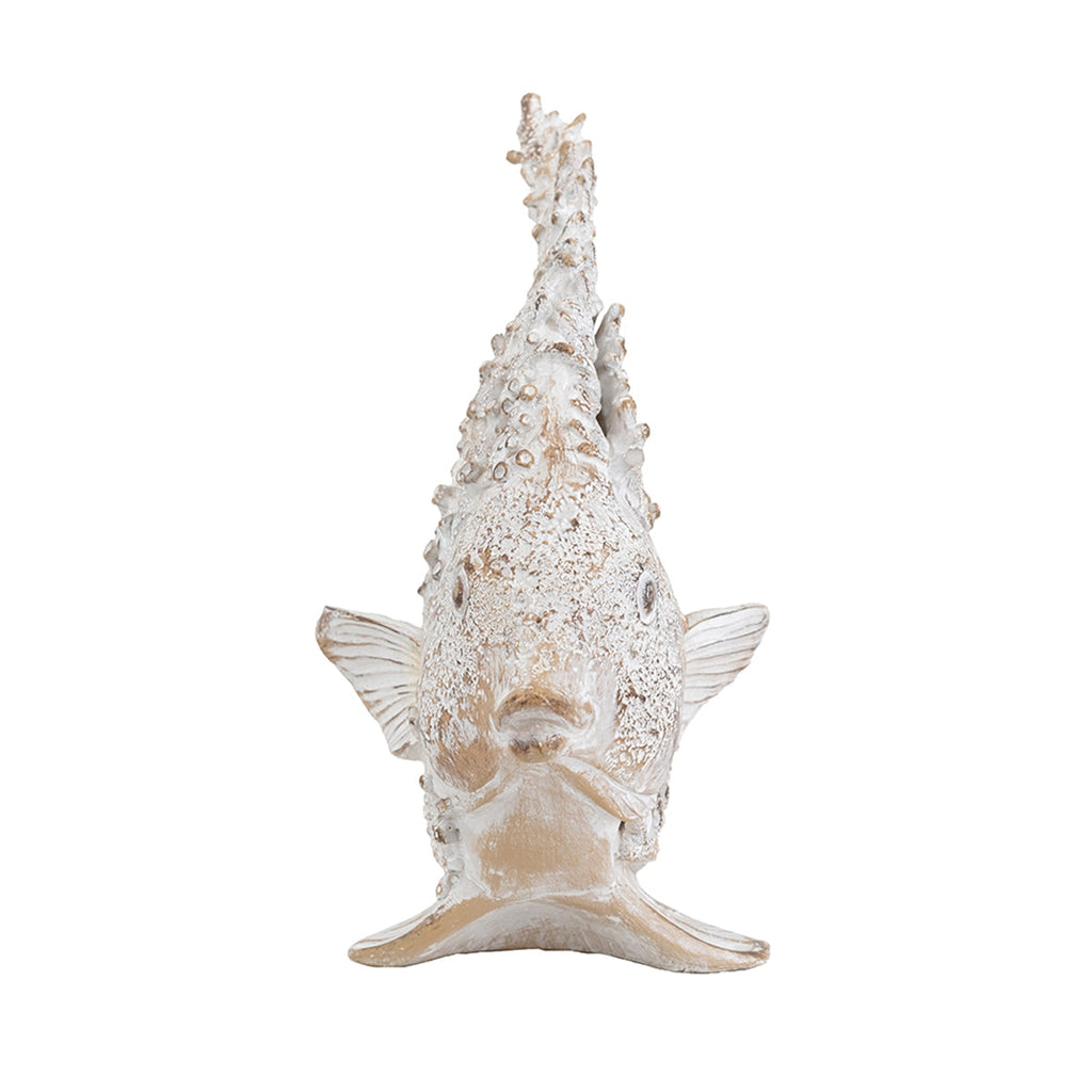 White coastal fish sculpture styled as an elegant accent in a beach house interior.