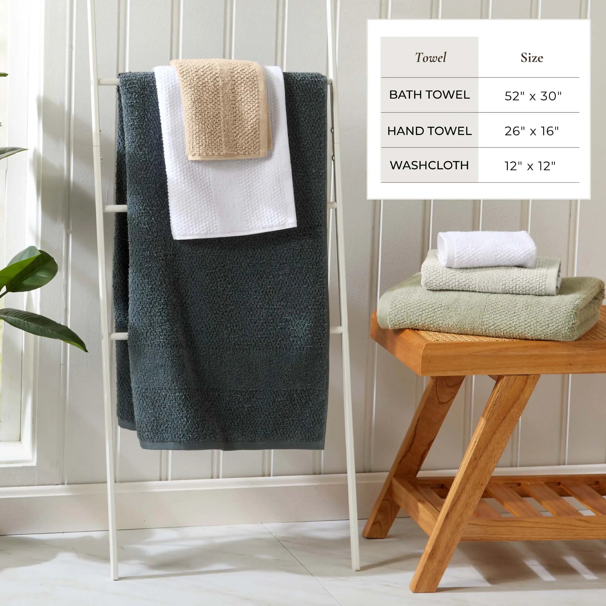 Bath towel set Marbella Collection, 100% cotton woven texture; dark teal towel with white hand towel on a rack.